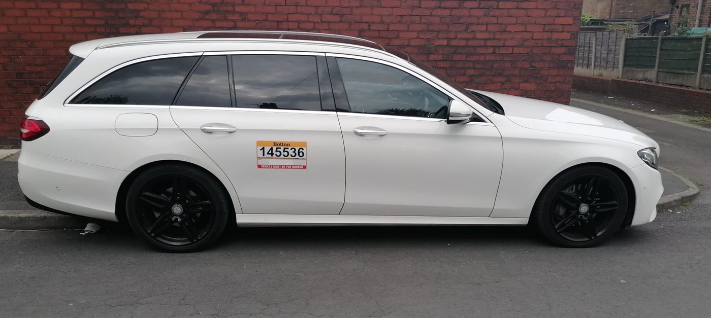 White Mercedes-Benz E-Class estate operated by MCR Elite Transfers, used on Manchester to Lancaster transfers