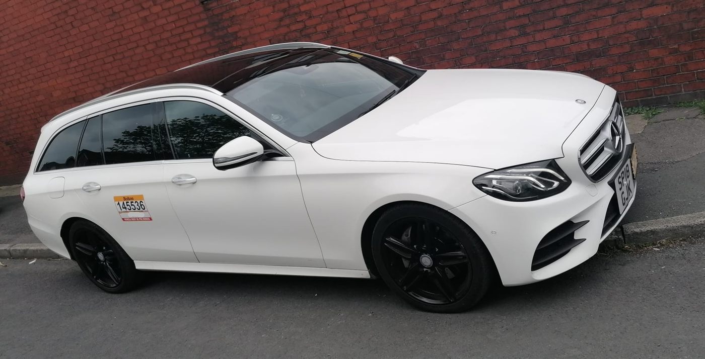 White Mercedes-Benz E-Class estate operated by MCR Elite Transfers, used on Manchester to Ambleside transfers